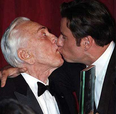 John Travolta kisses Kirk Douglas
